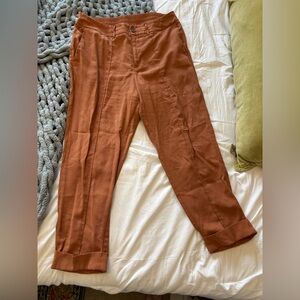 Women’s orange cropped pleated trousers